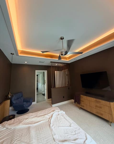 Master bedroom remodel with slat divider and tray ceiling