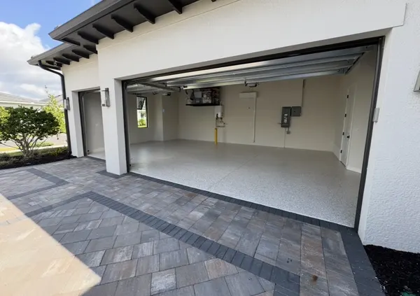 Epoxy garage floor with paver driveway