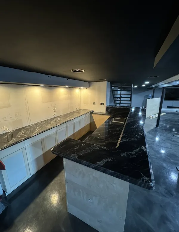 Basement wet bar build with black granite countertop in progress