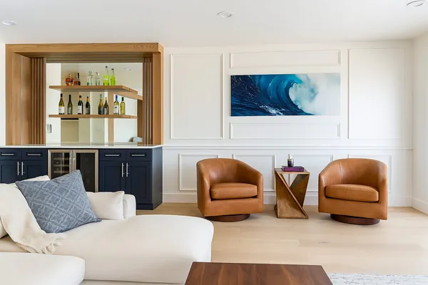 Custom wainscoting feature wall and built-in wet bar