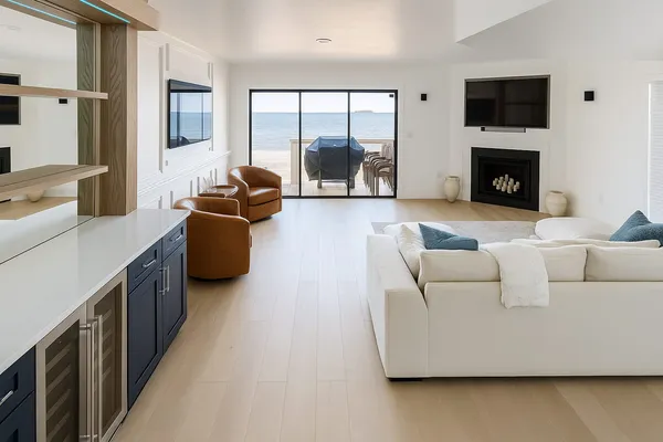 Coastal great room renovation with fireplace and LVP flooring