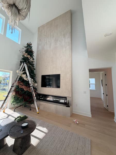 Two-story porcelain tile fireplace feature wall