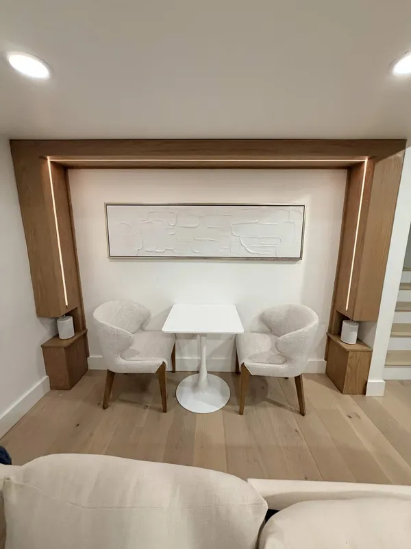 Custom white oak seating nook with integrated LED accent lighting