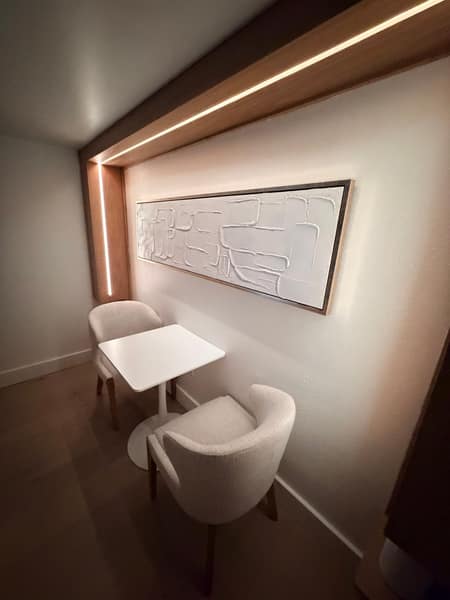 Accent-lit wood niche with cove lighting