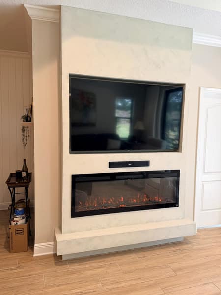Venetian plaster fireplace and media feature wall