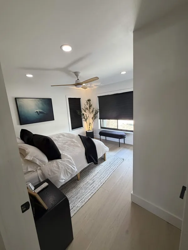 Bedroom remodel with wide-plank white oak flooring
