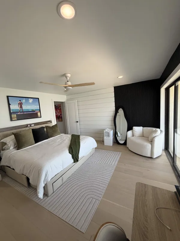 Primary bedroom remodel with shiplap wall and black slat accent wall