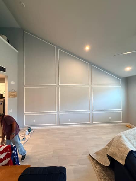 Picture-frame wainscoting feature wall on vaulted wall